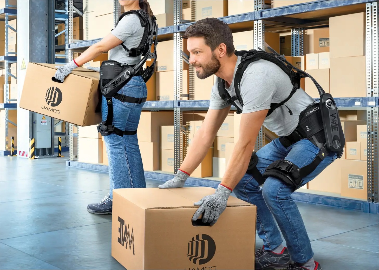 Workers with Comau MATE exoskeleton