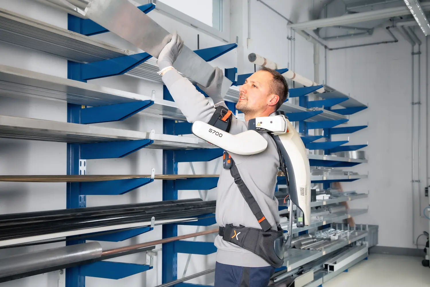 Worker with exoIQ S700 shoulder exoskeleton