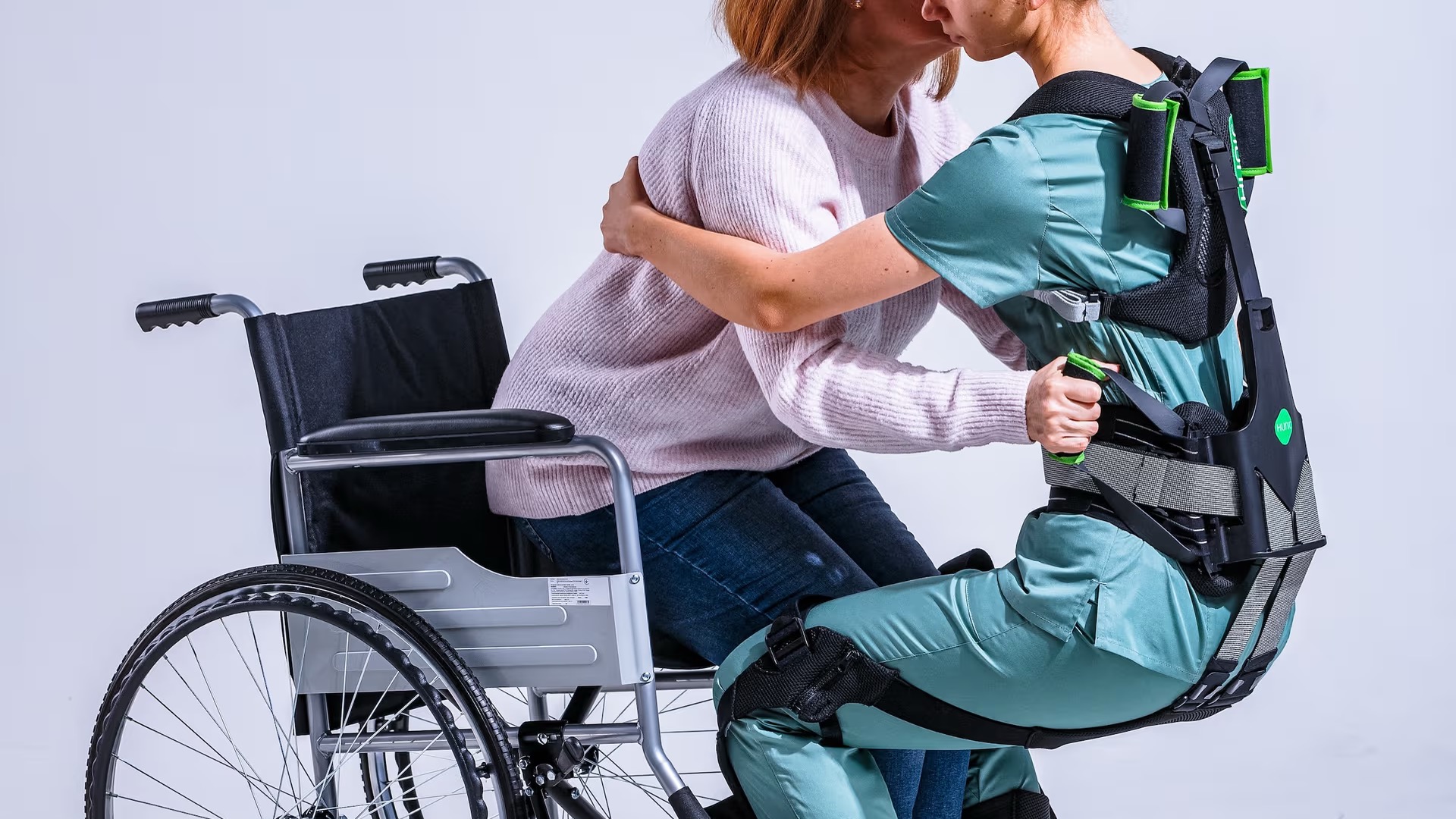 Healthcare worker wearing exoskeleton
