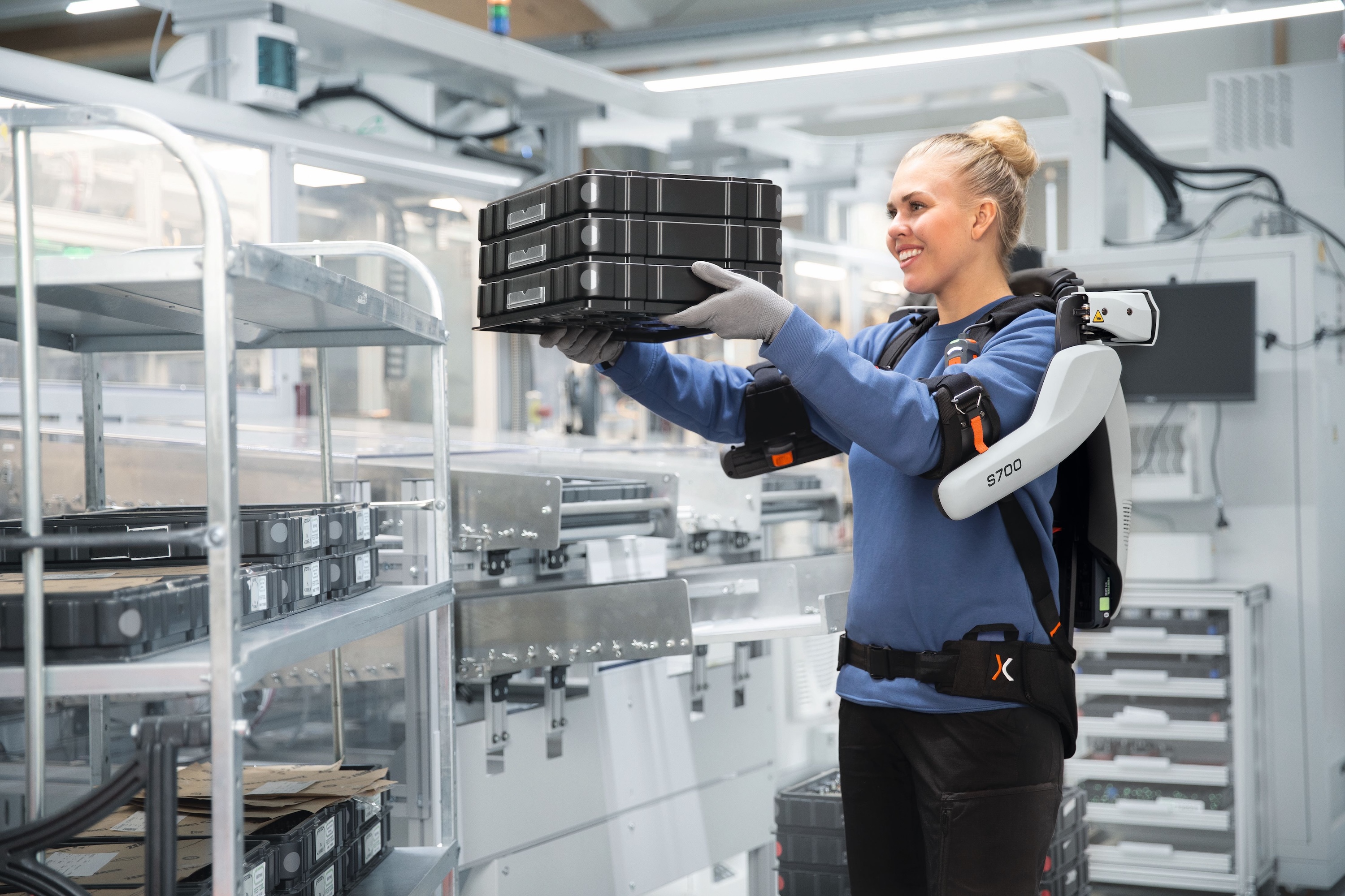 Worker with exoIQ S700 shoulder exoskeleton