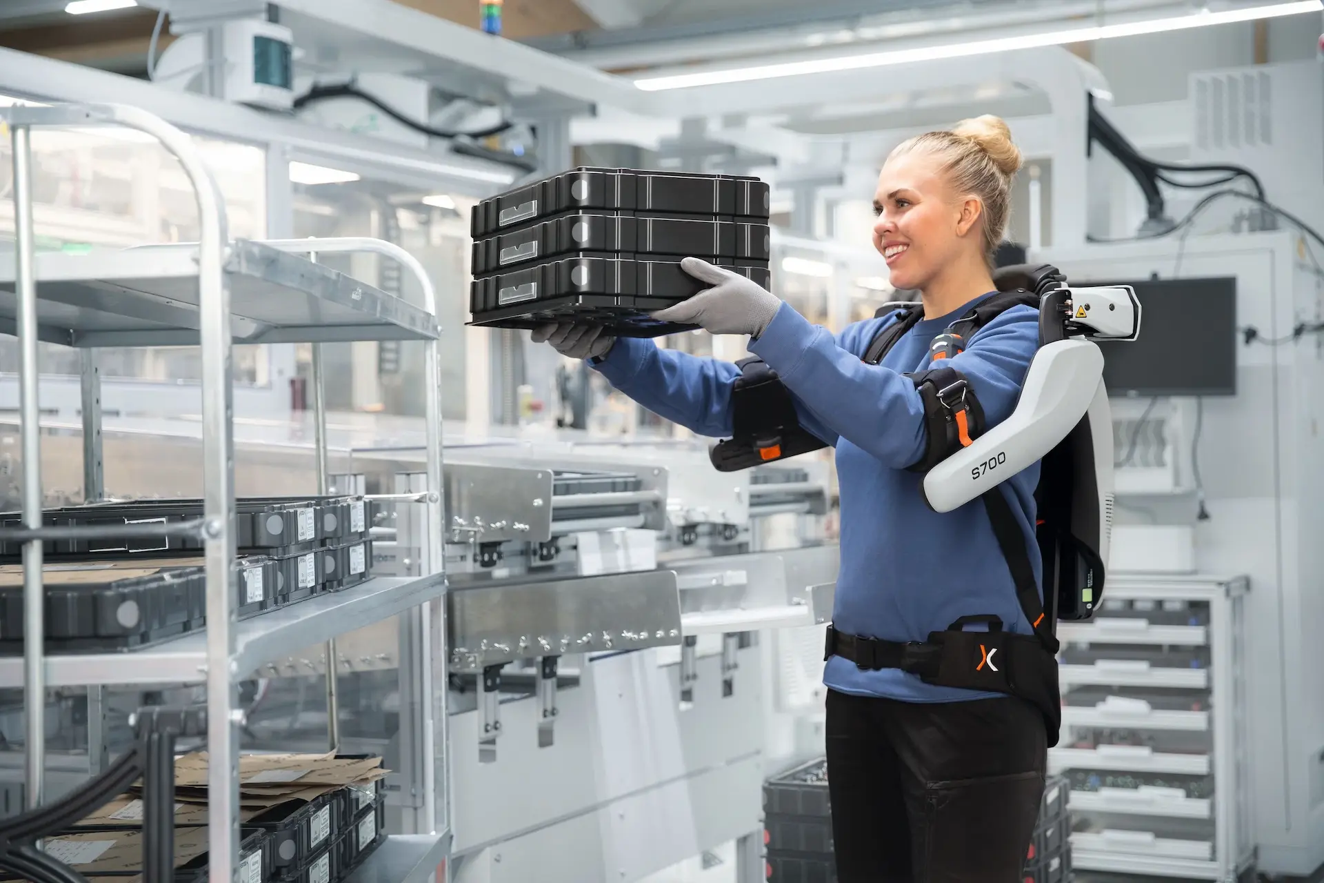 Worker with exoIQ S700 shoulder exoskeleton