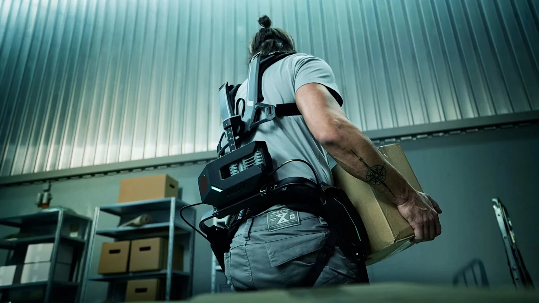 Worker with VOLTON exoskeleton