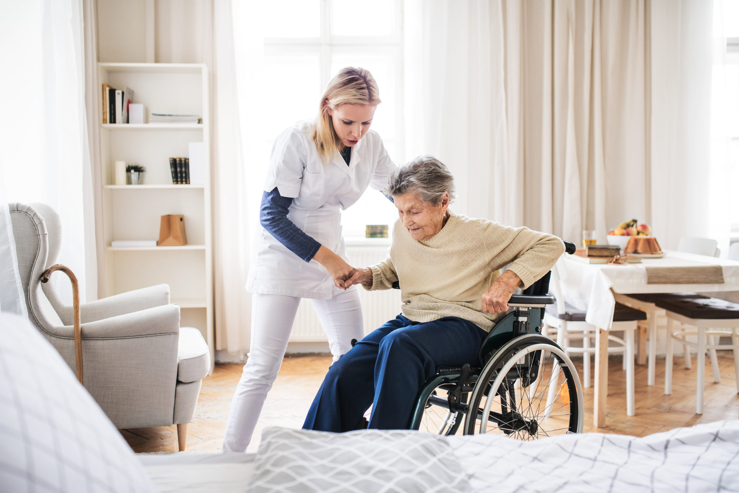 Care home worker wearing exoskeleton
