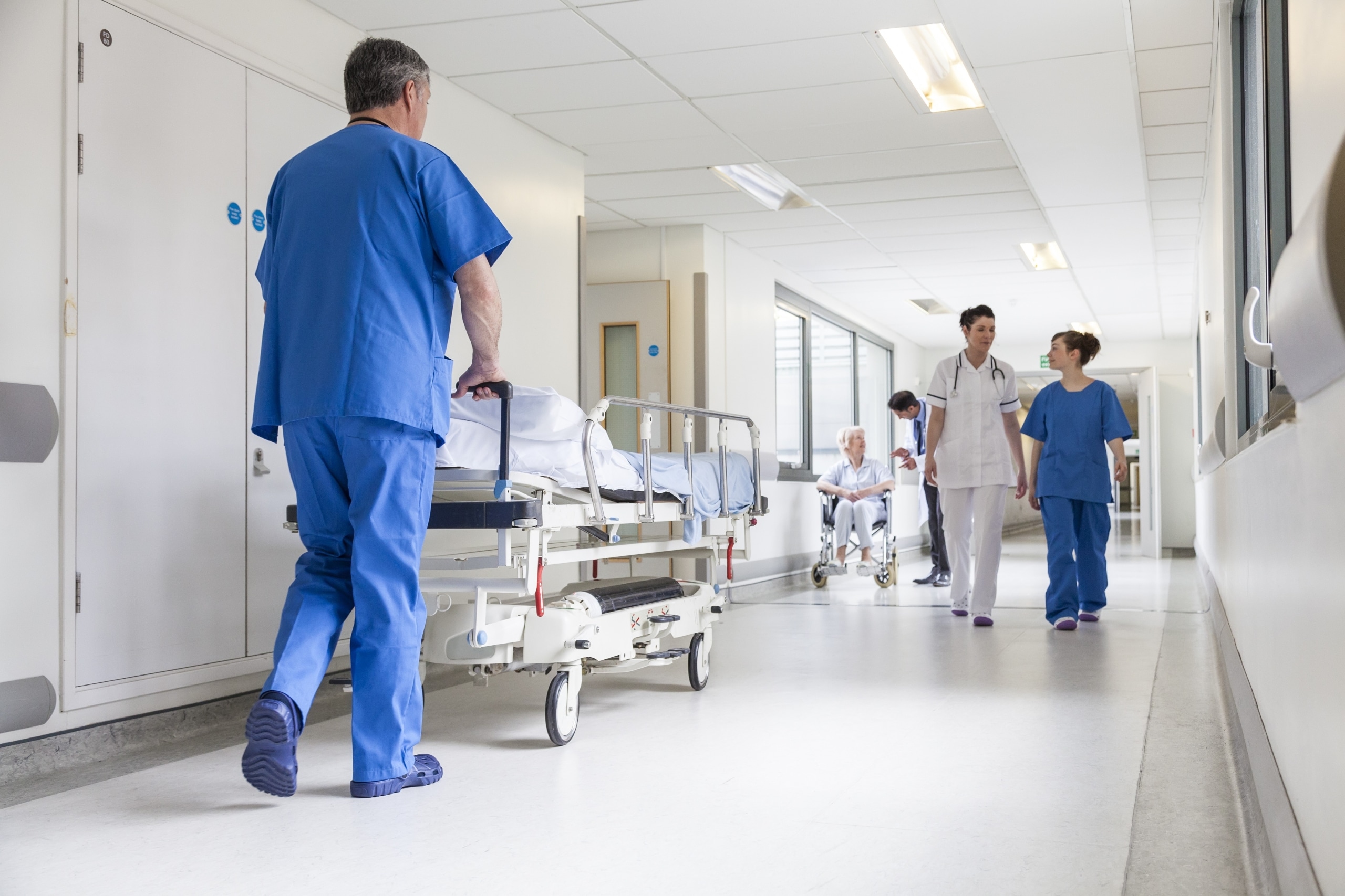 Healthcare worker wearing exoskeleton
