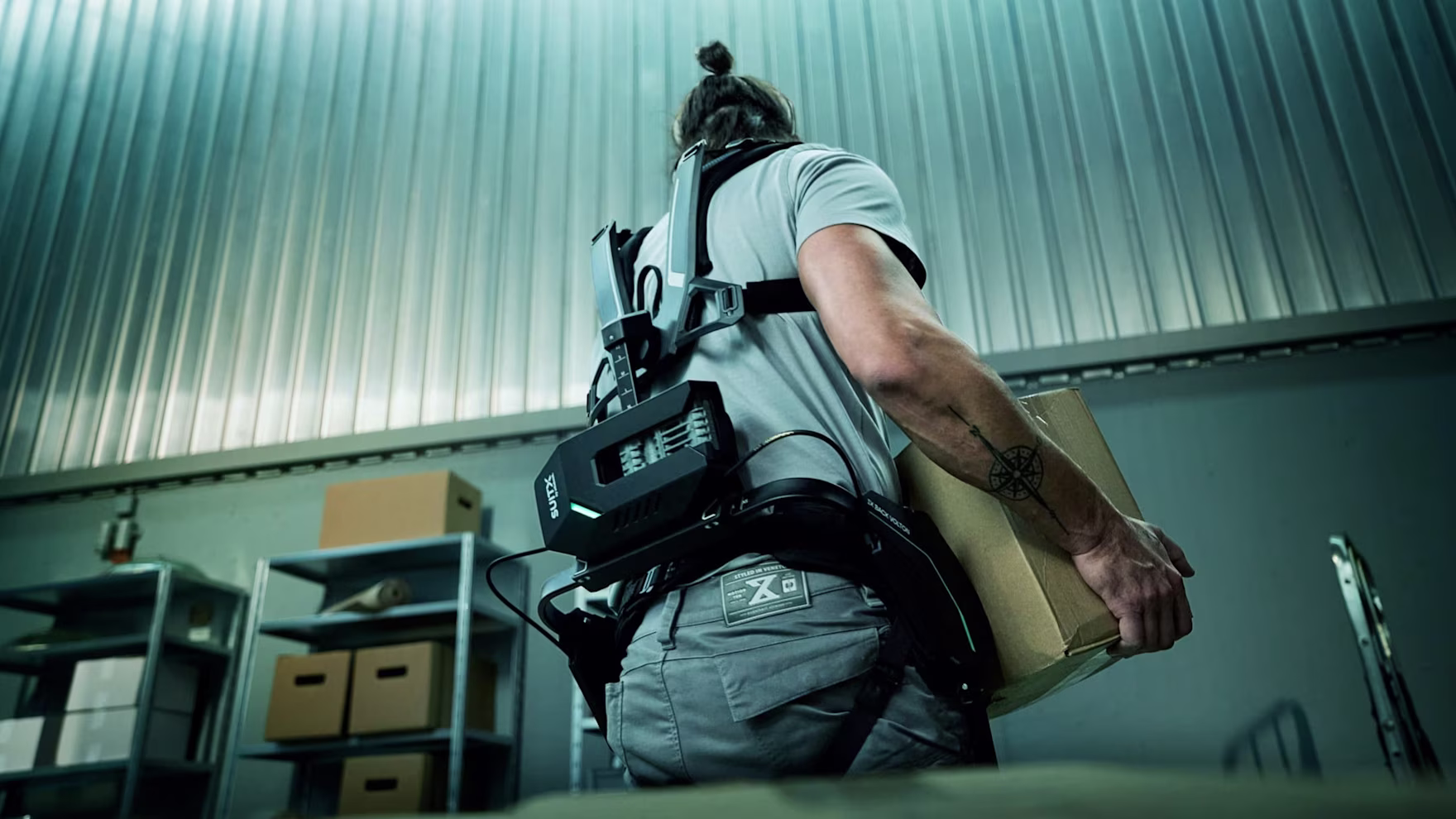 Worker with VOLTON exoskeleton